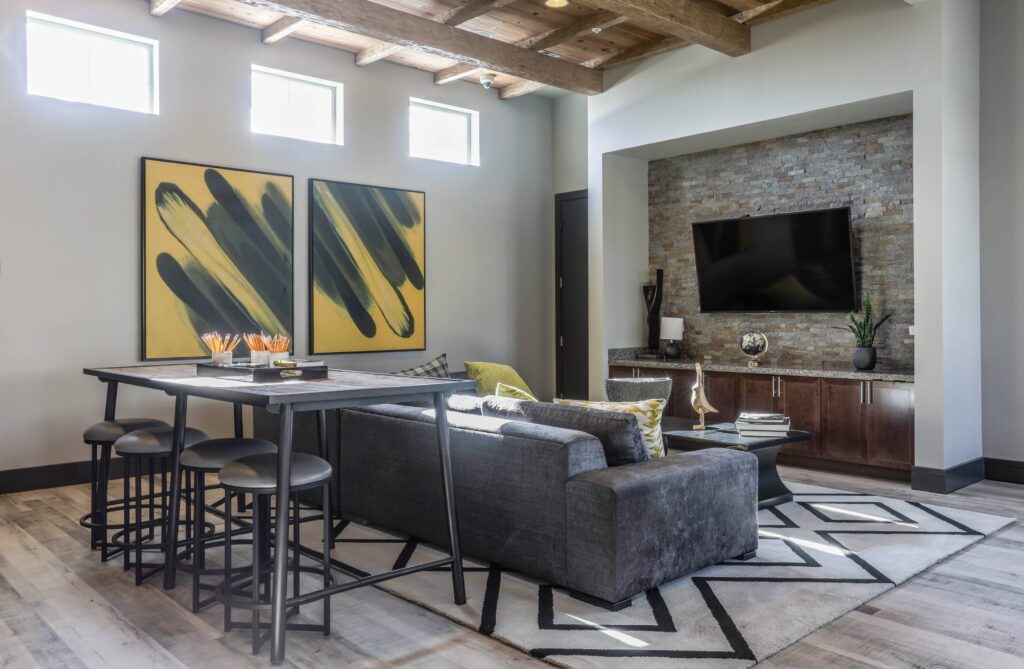 Clubhouse lounge with sofas and TVs