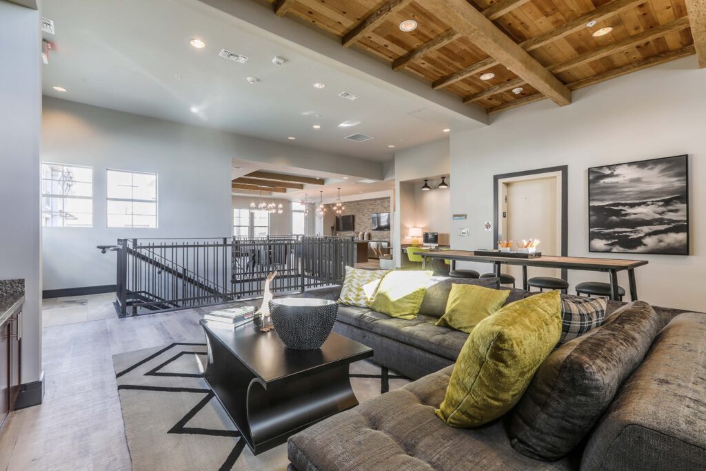 Clubhouse lounge with sofas and TVs