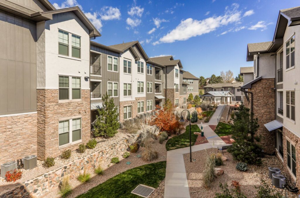 Green space between building with walking path