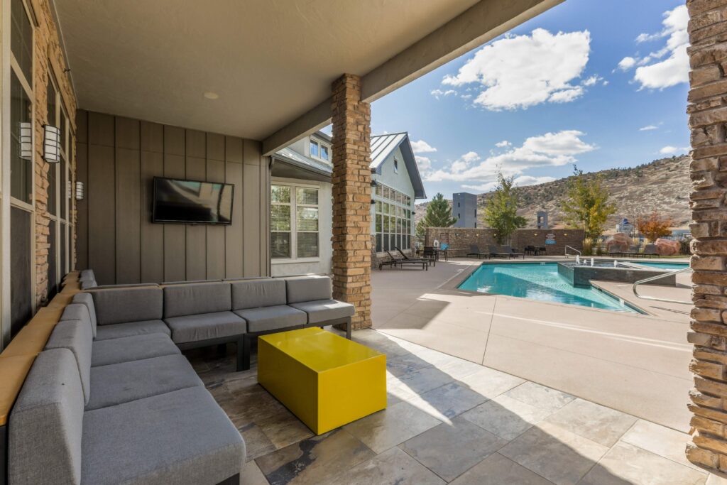 Outdoor patio with TV by the pool